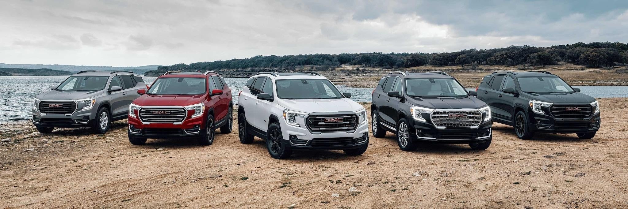 GMC cars in one row river side