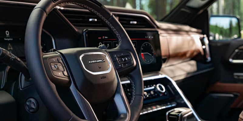 2026 GMC Sierra 1500 steering wheel and premium driver cockpit