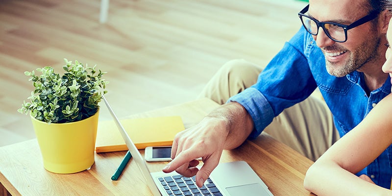 Spence GMC customer looking at frequently asked questions